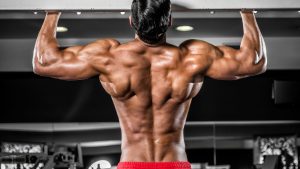 Young male athlete performing pull-ups